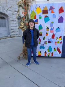 Rita standing outside sukkah in Kingston.